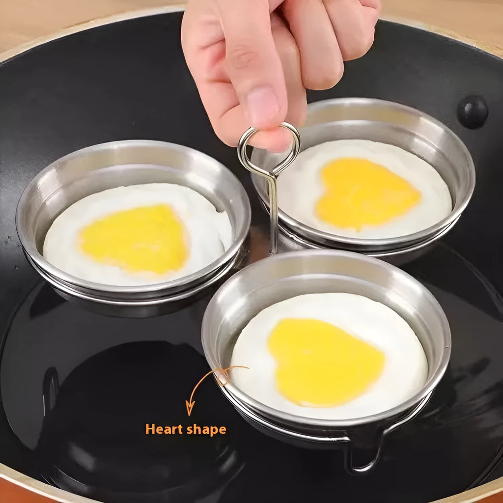 Stainless steel mini egg steamer in heart-shaped and round designs for boiling and stewing eggs.
