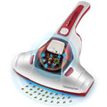 Pink handheld vacuum mite removal tool with hose connection and power cord.
