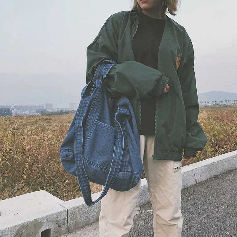 Large canvas denim tote bag in dark blue with polyester lining and horizontal square shape