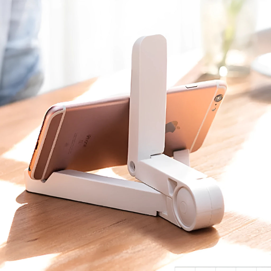 Black foldable tablet holder holding a smartphone in landscape mode on a desk.