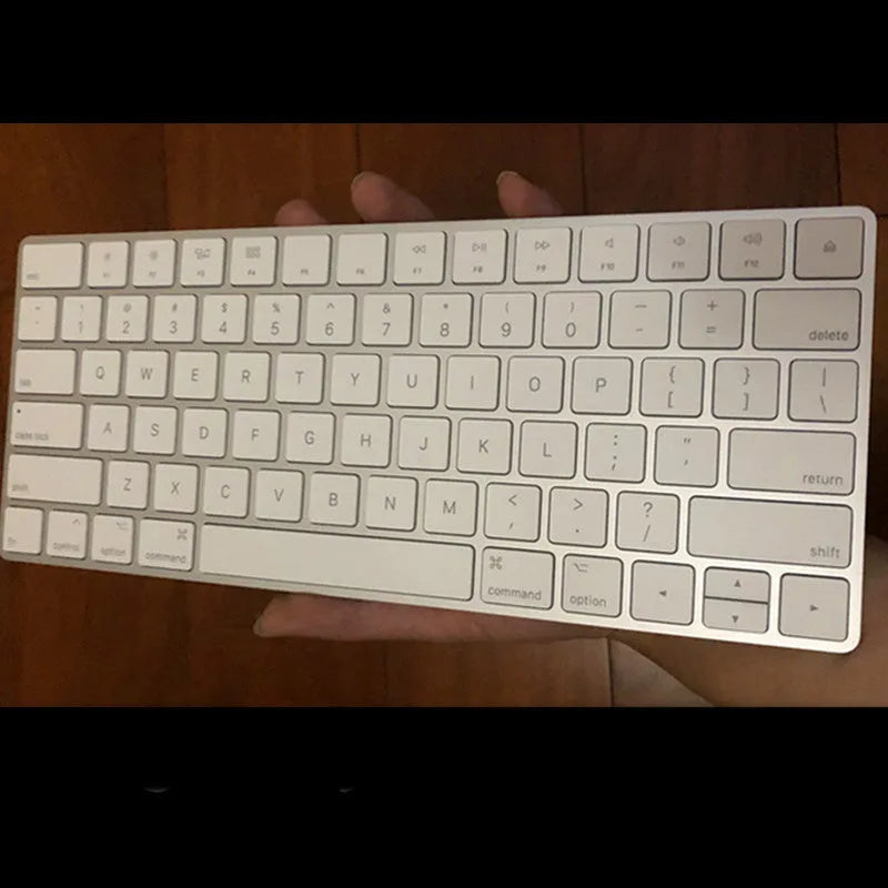Apple G6 ultra-thin aluminium Bluetooth wireless keyboard in white, showing multimedia function keys.
