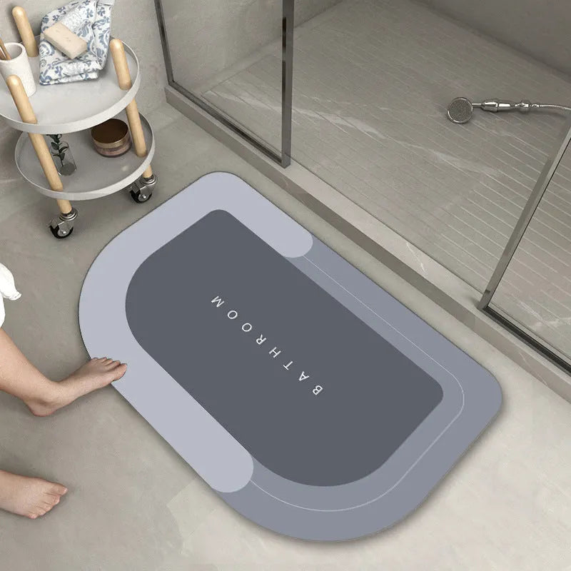 Blended fabric floor mat in an oval shape on a bathroom floor, available in multiple colours and sizes.