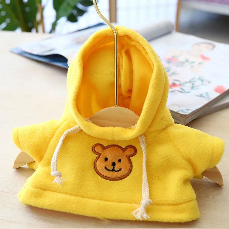Dog wearing a blue hooded balaclava sweater, showing the integrated hood design and cloth fabric.