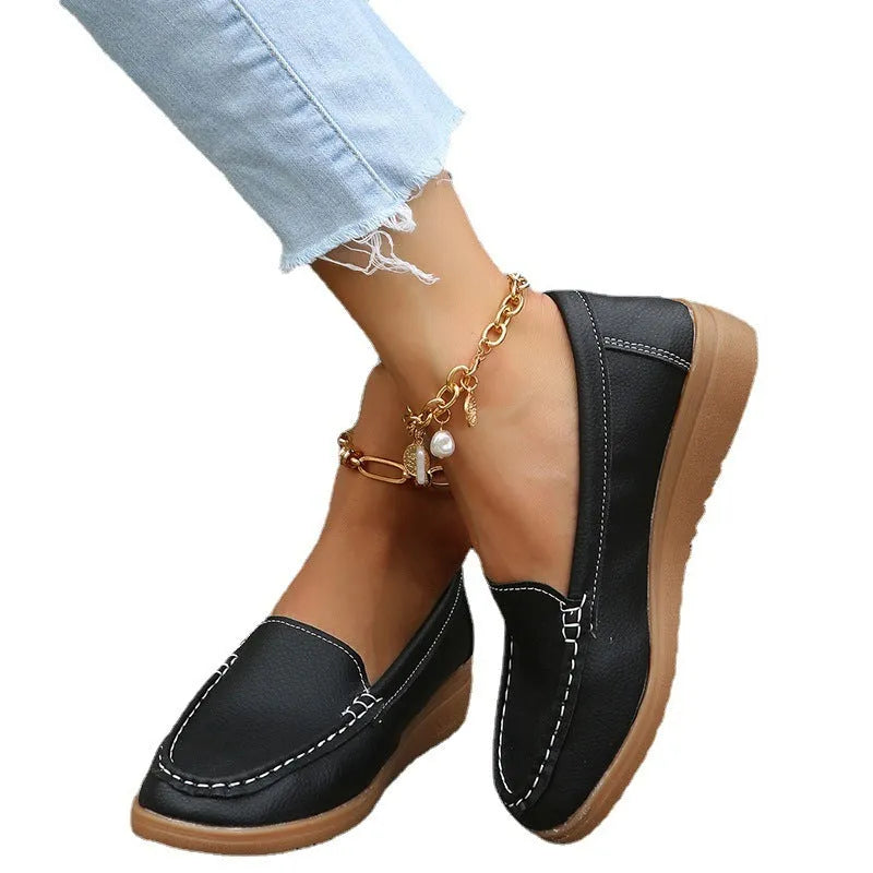 Women's flat loafers in PU leather with car stitch detail and round toe, shown in multiple colours.