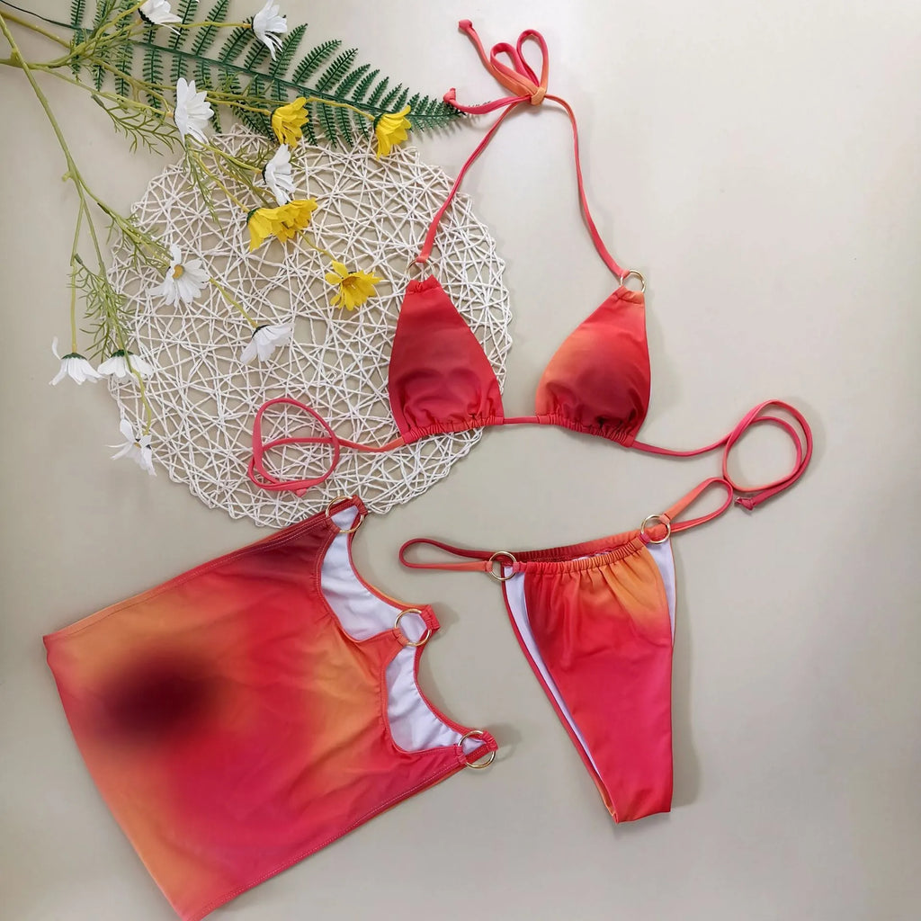Tie-dye solid colour gradient three-piece halter-neck bikini set with skirt on a mannequin.