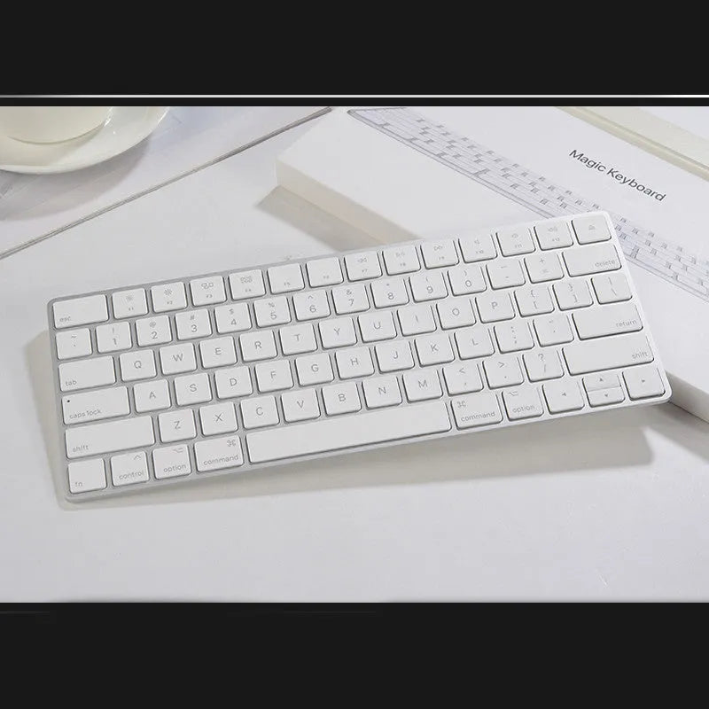 Apple G6 ultra-thin aluminium Bluetooth wireless keyboard in white, showing multimedia function keys.