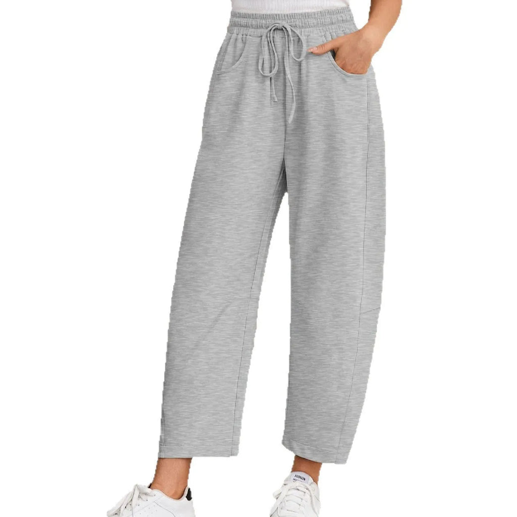 Loose cropped sweatpants with drawstring waist and side pockets in European street style