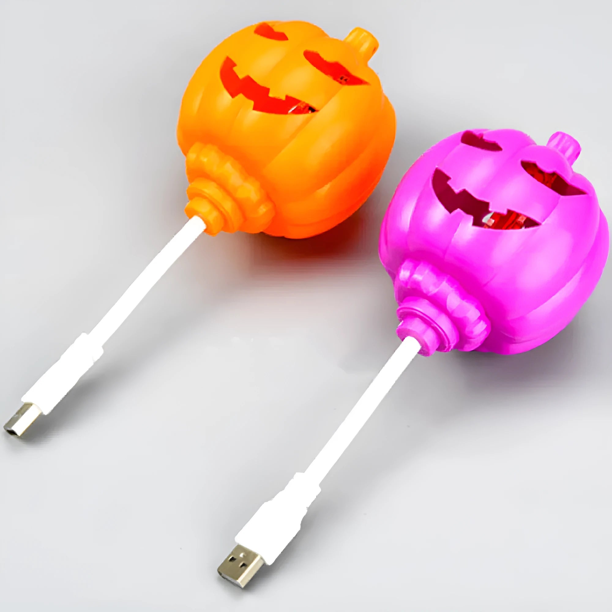 Plastic pumpkin-shaped decorative lamp with USB cable, showing purple or yellow light option.