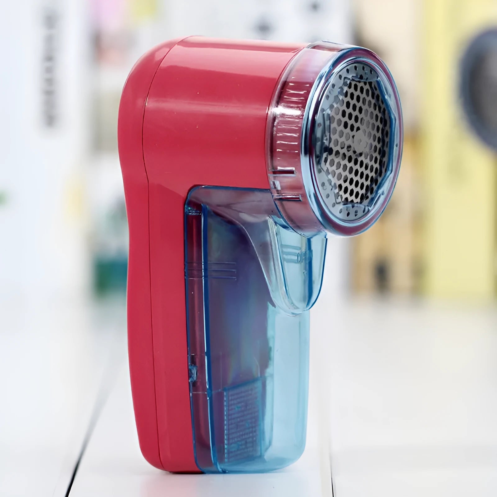 Portable electric clothing lint remover unit in a compact size.