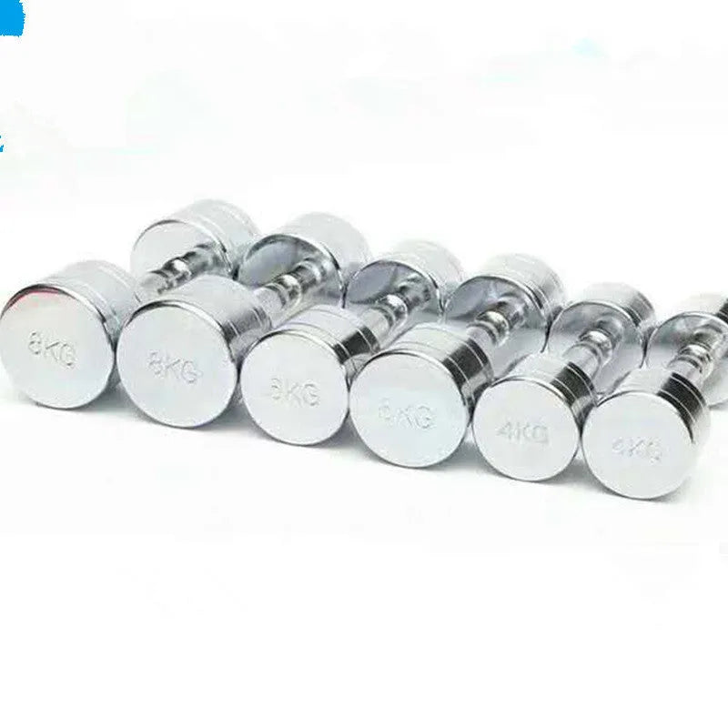 Silver electroplated steel dumbbell with hexagonal handle on a gym floor