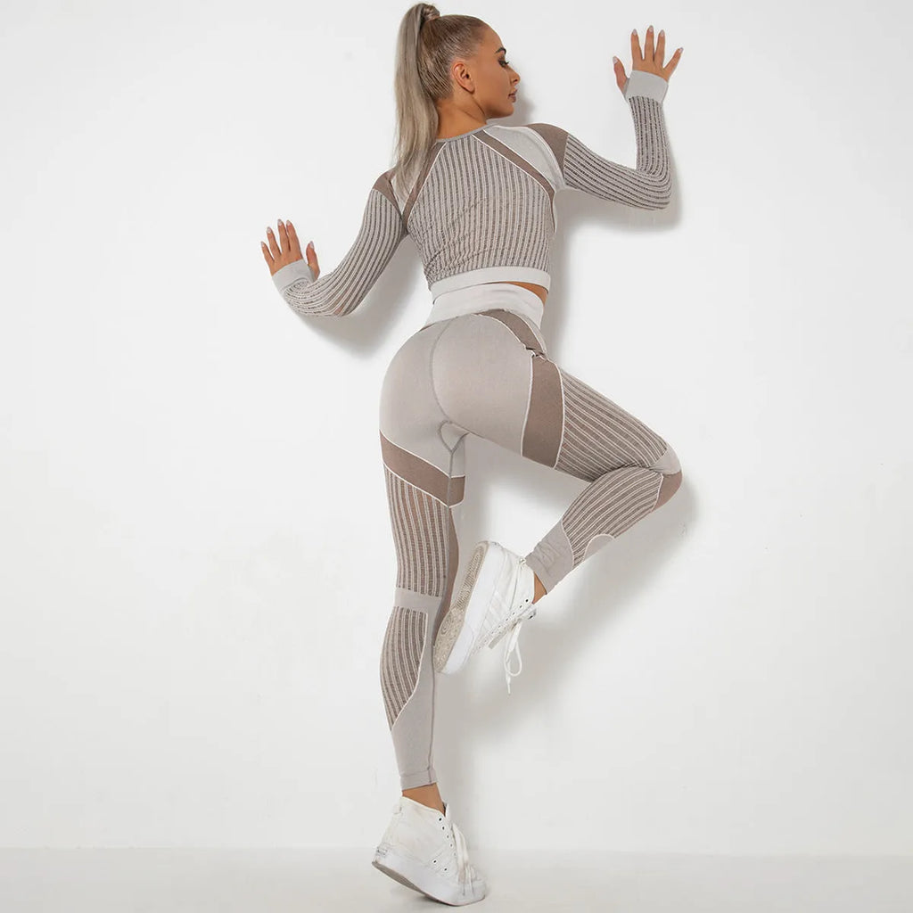 Woman wearing a long-sleeved seamless knitted yoga wearsuit in a stripe pattern, demonstrating a yoga pose.