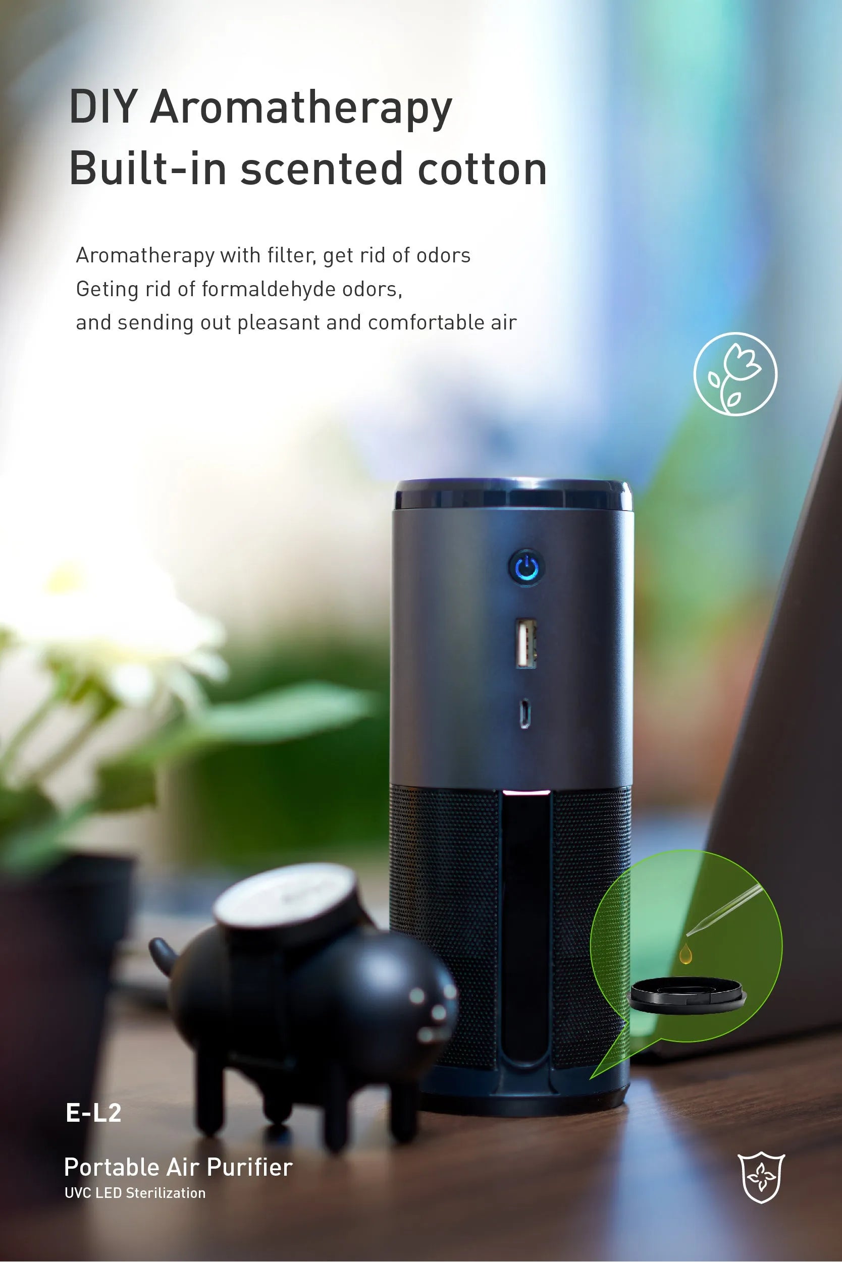 Compact black portable car air purifier with USB port and air quality indicator light.