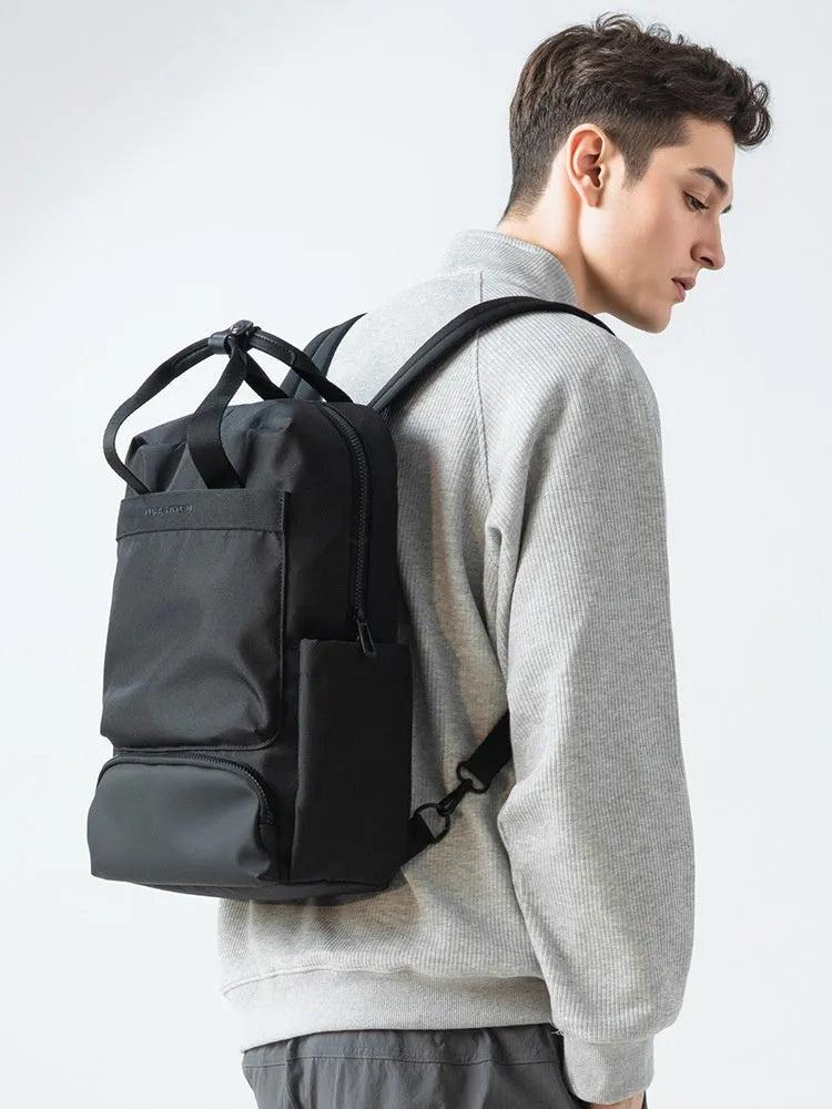 Elegant black computer backpack with 20-35L capacity and multiple storage compartments