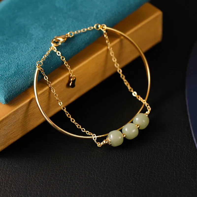 Women's Hetian jade bead bracelet with gold inlay detailing in single, double and three bead versions