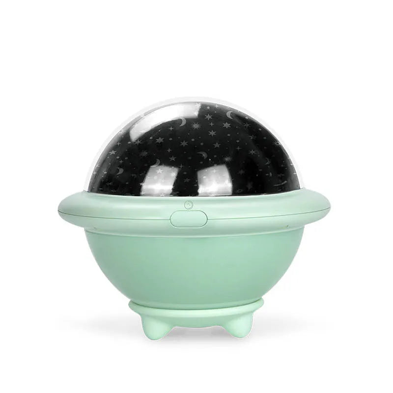 UFO-shaped starry sky projection night light in pink, white or green on a surface