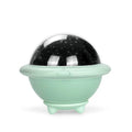 UFO-shaped starry sky projection night light in pink, white or green on a surface