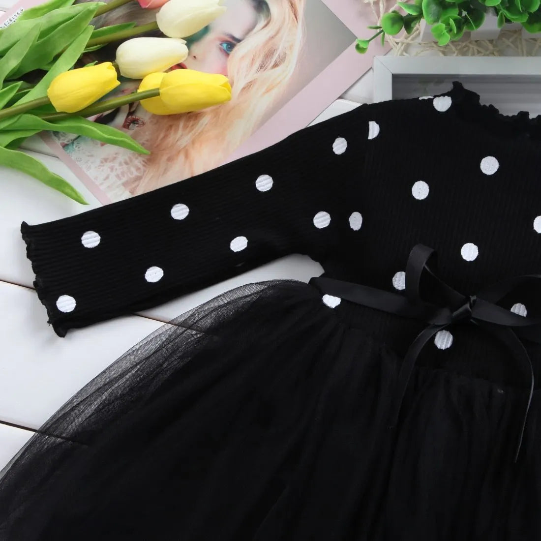 Baby girl wearing black lace tutu dress with long sleeves for birthday party