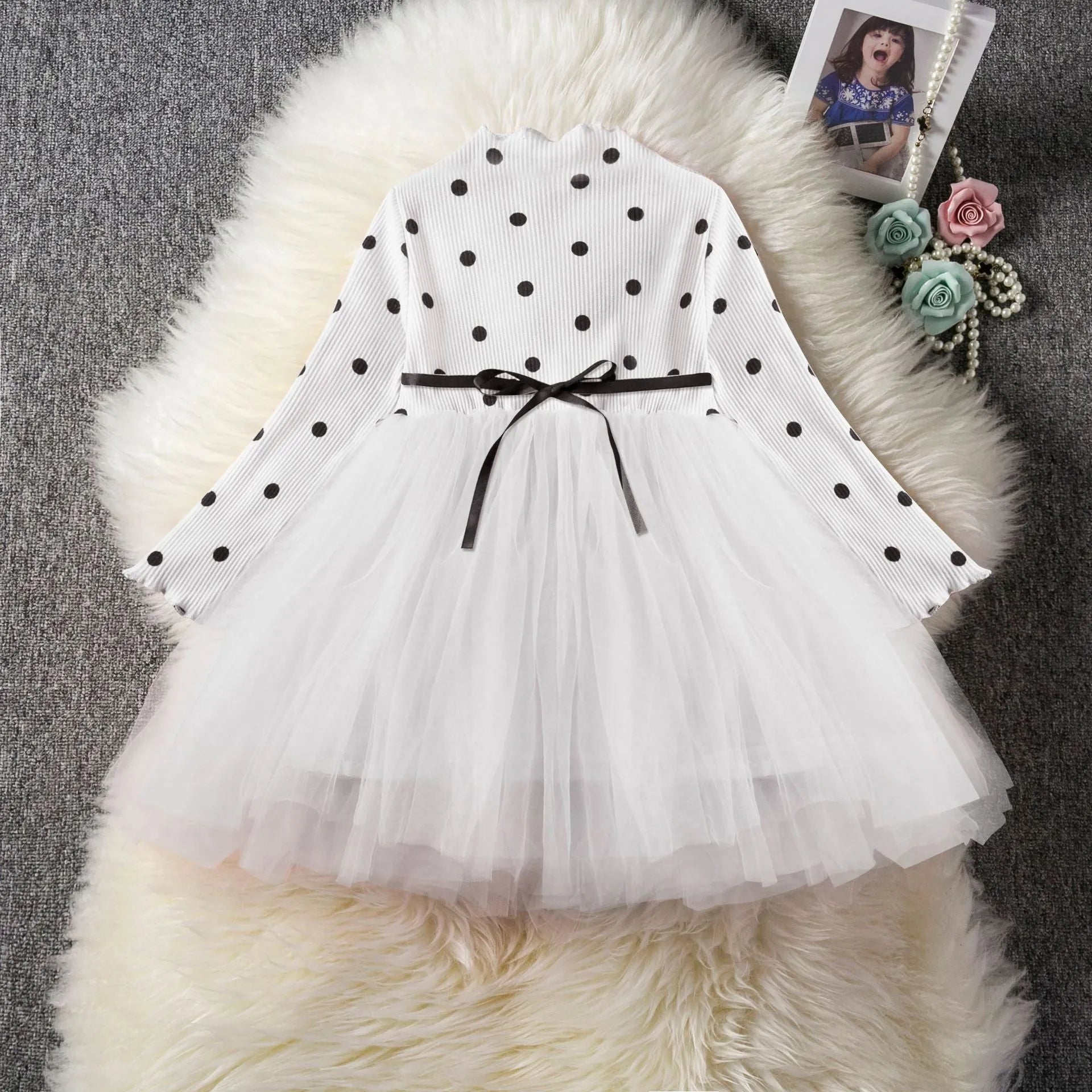 Baby girl wearing black lace tutu dress with long sleeves for birthday party