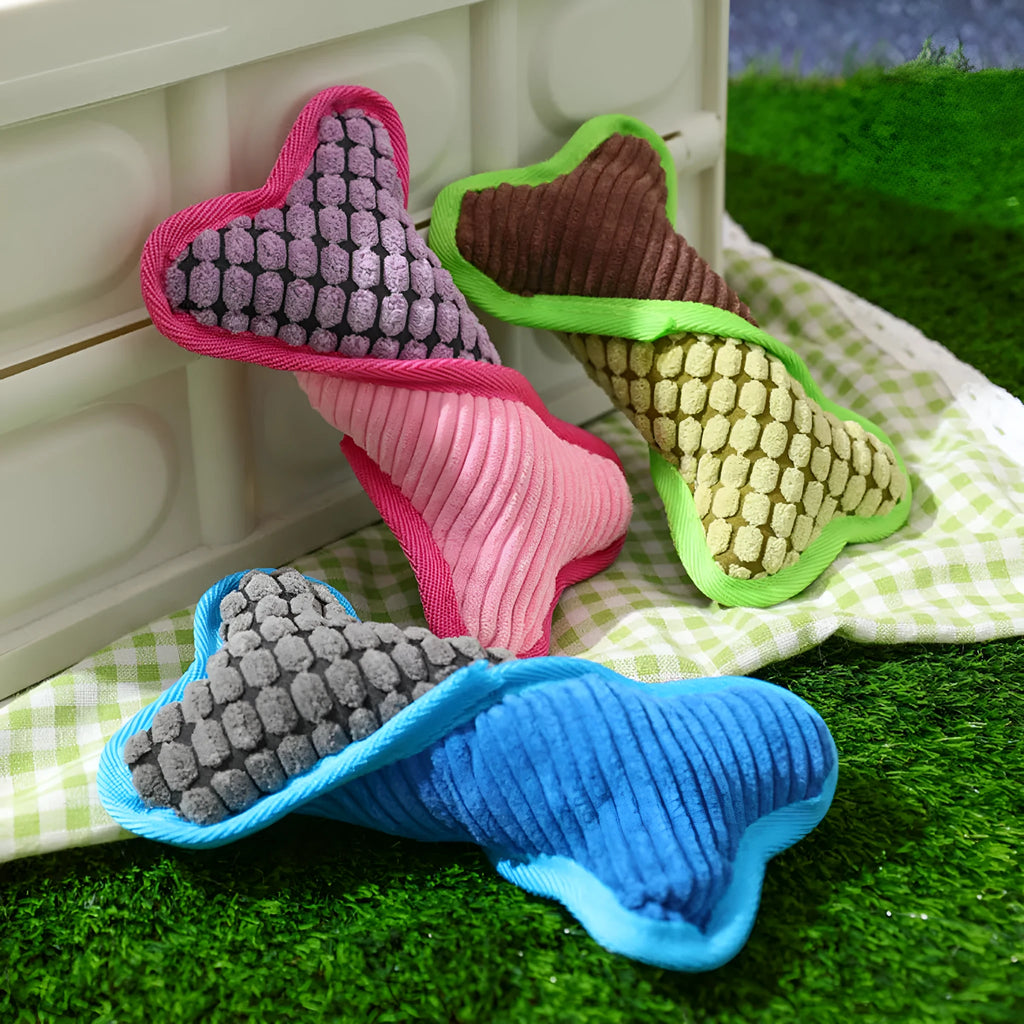 Blue tough plush teddy dog toy with a bone-shaped squeaker and soft corn fleece lining for bite-resistant play.