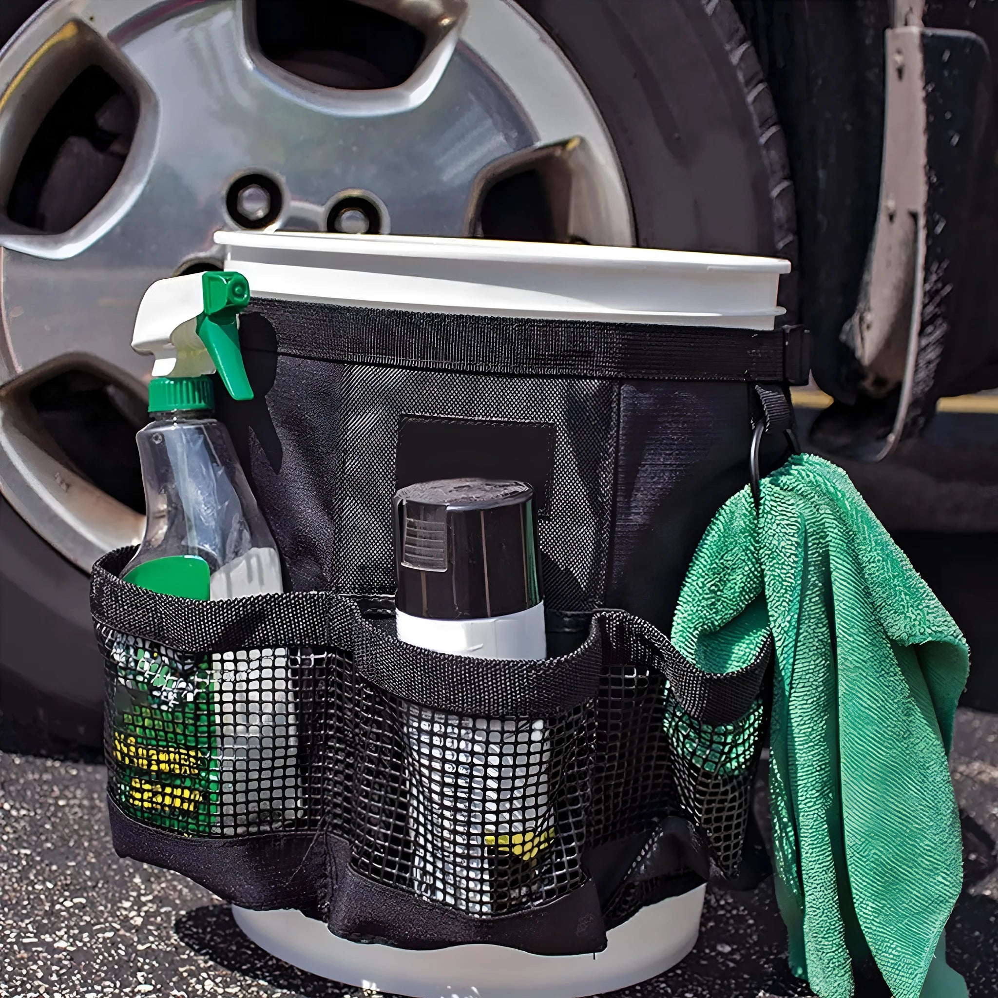 Black cylindrical hanging storage bag designed for 5 gallon barrels with car washing tools