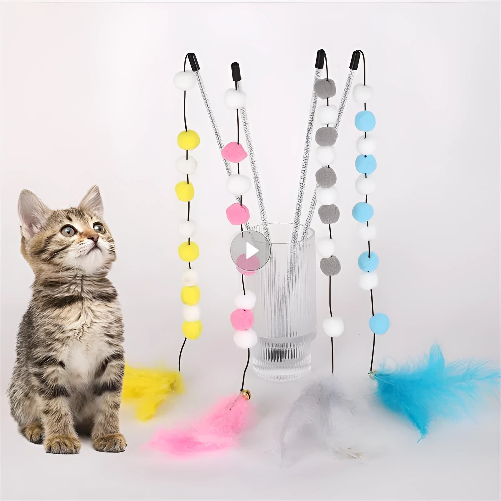 Colourful cat teaser stick with bell and feather toys measuring 31cm long