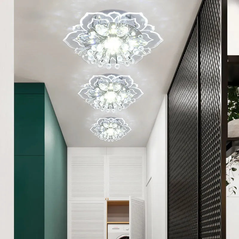 Small modern crystal ceiling lamp with flower-shaped shade in crystal, acrylic, and stainless steel materials