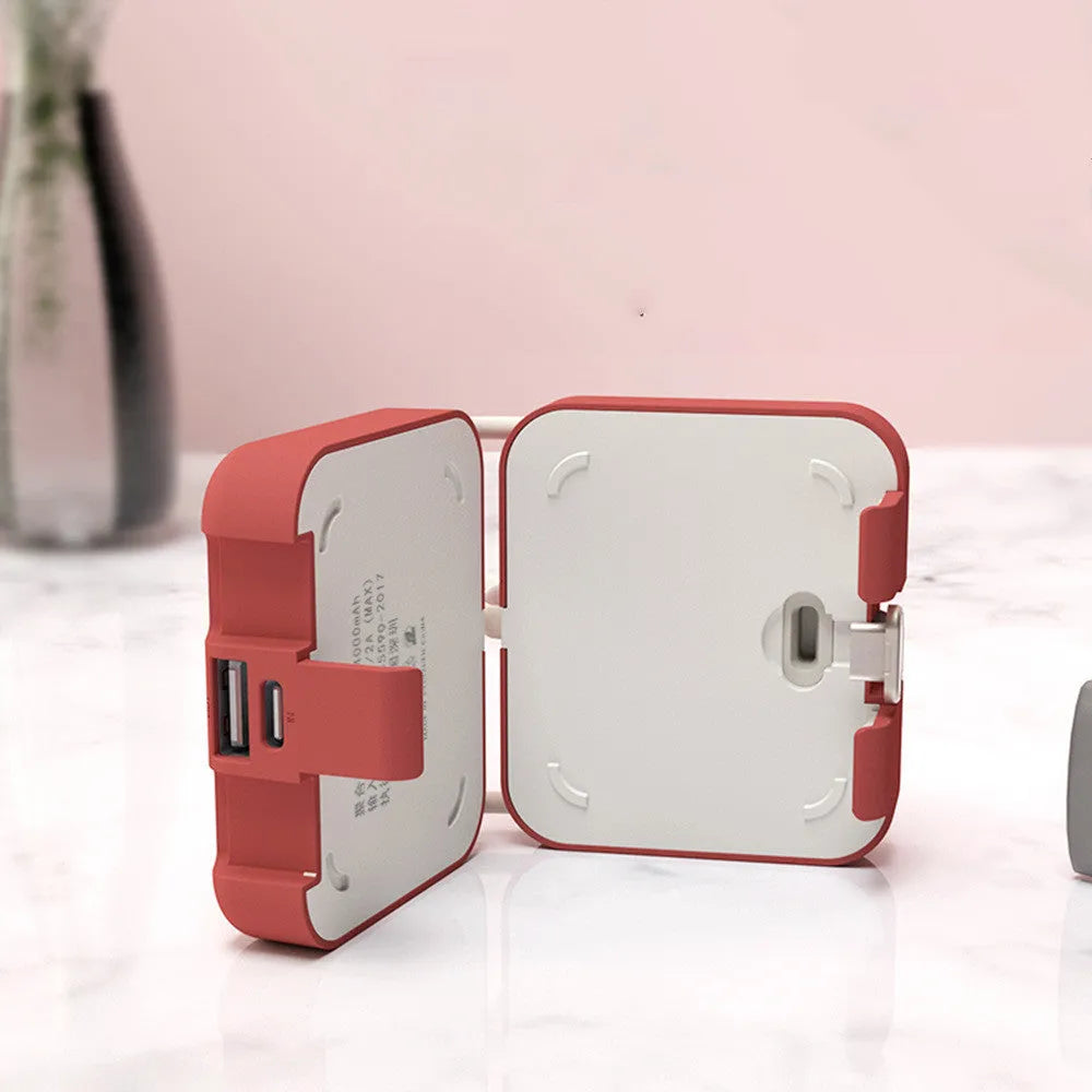 Handbag back clip power bank in blue showing USB-A and Type-C ports and integrated phone stand function.