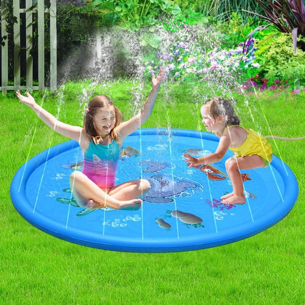 Blue PVC children's water spray mat with marine animal designs laid on grass, connected to a garden hose.