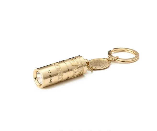 Gold zinc alloy waterproof LED flashlight attached to a keychain.
