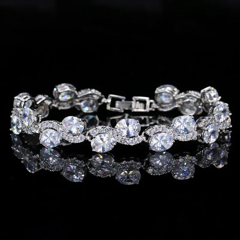 Copper-plated gold bracelet with zircon stones showing 18.4cm length and geometry design