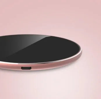 Ultra-thin aluminium wireless charger in golden finish showing LED indicator and Micro USB port