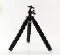 Black flexible mini octopus tripod with bendable legs and 1/4-20 camera mount screw