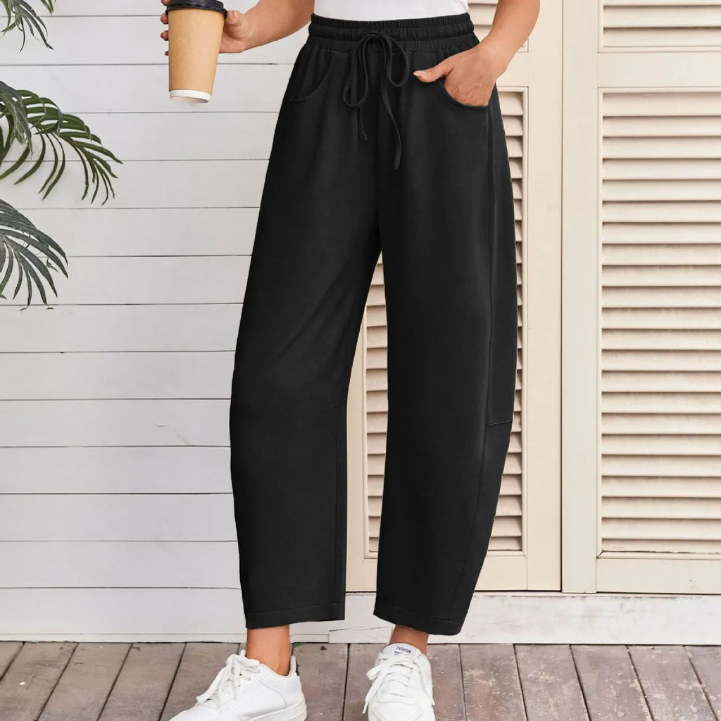 Loose cropped sweatpants with drawstring waist and side pockets in European street style