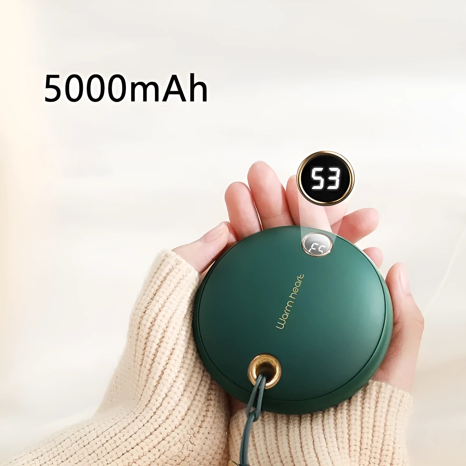 Green hand warmer power bank with digital display showing 5000mAh capacity and heating function