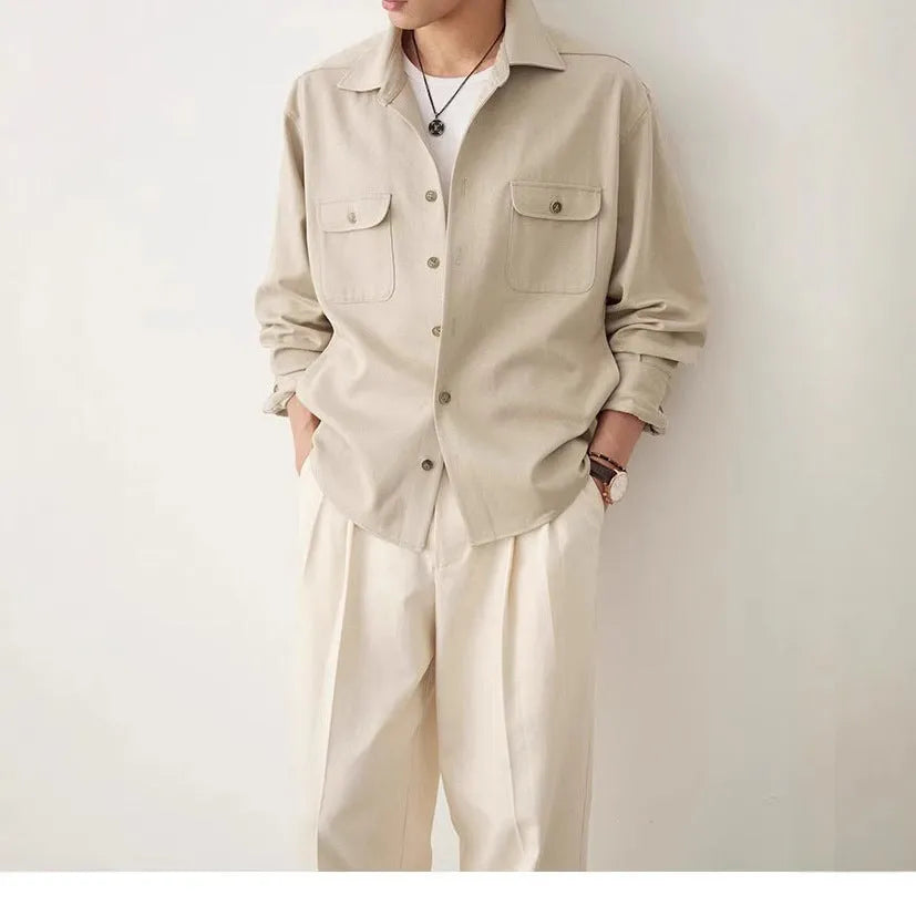 Men's light sand rice colour casual long sleeve shirt with a simple lapel, on a hanger.