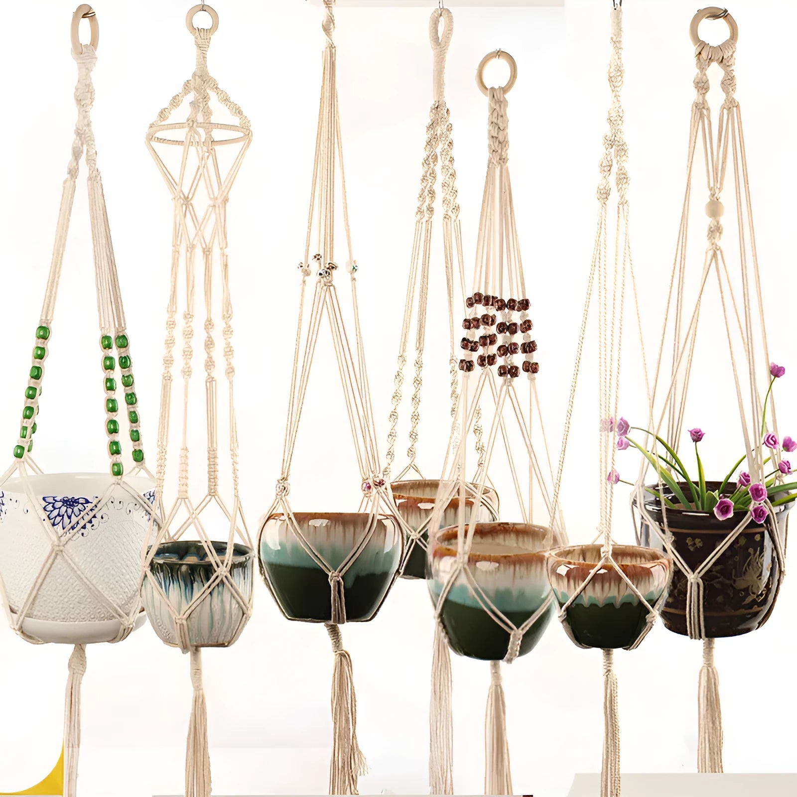 Woven wire basket made of cotton rope shown in a desktop setting.