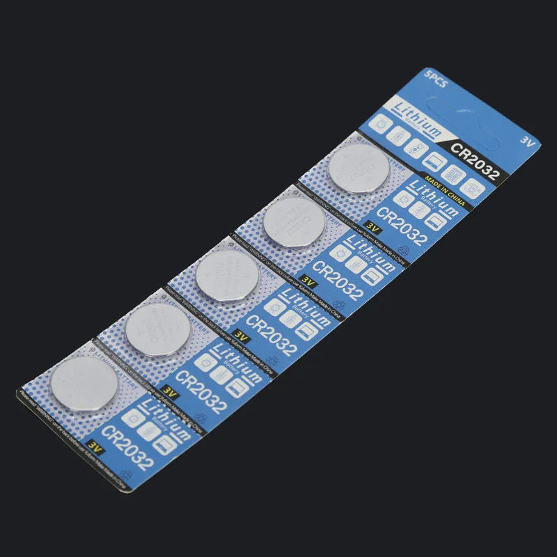 CR2032 3V lithium button battery showing front and side views with scale