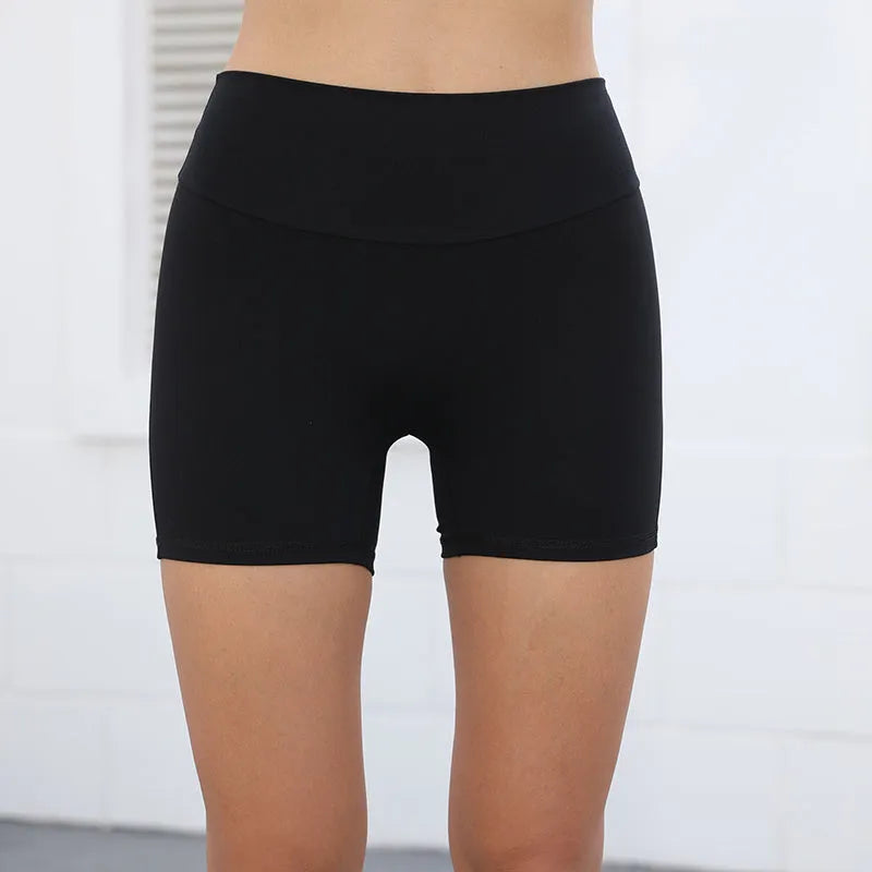 Women's high waist hip lifting fitness shorts in Electric Blue with side pockets.