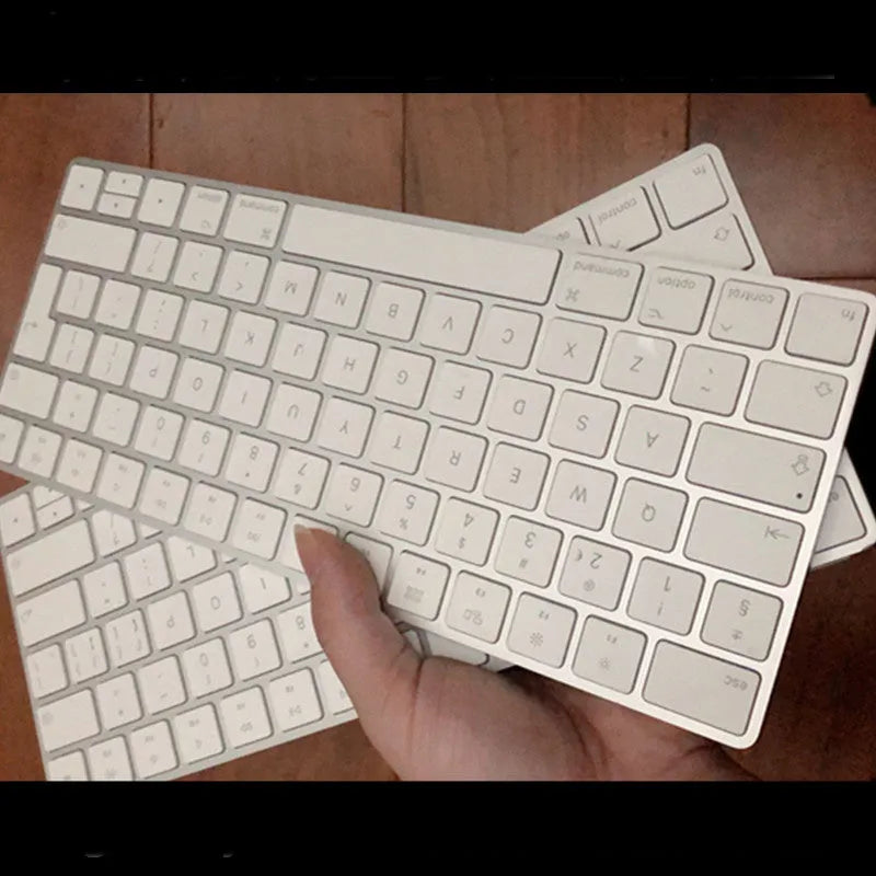 Apple G6 ultra-thin aluminium Bluetooth wireless keyboard in white, showing multimedia function keys.