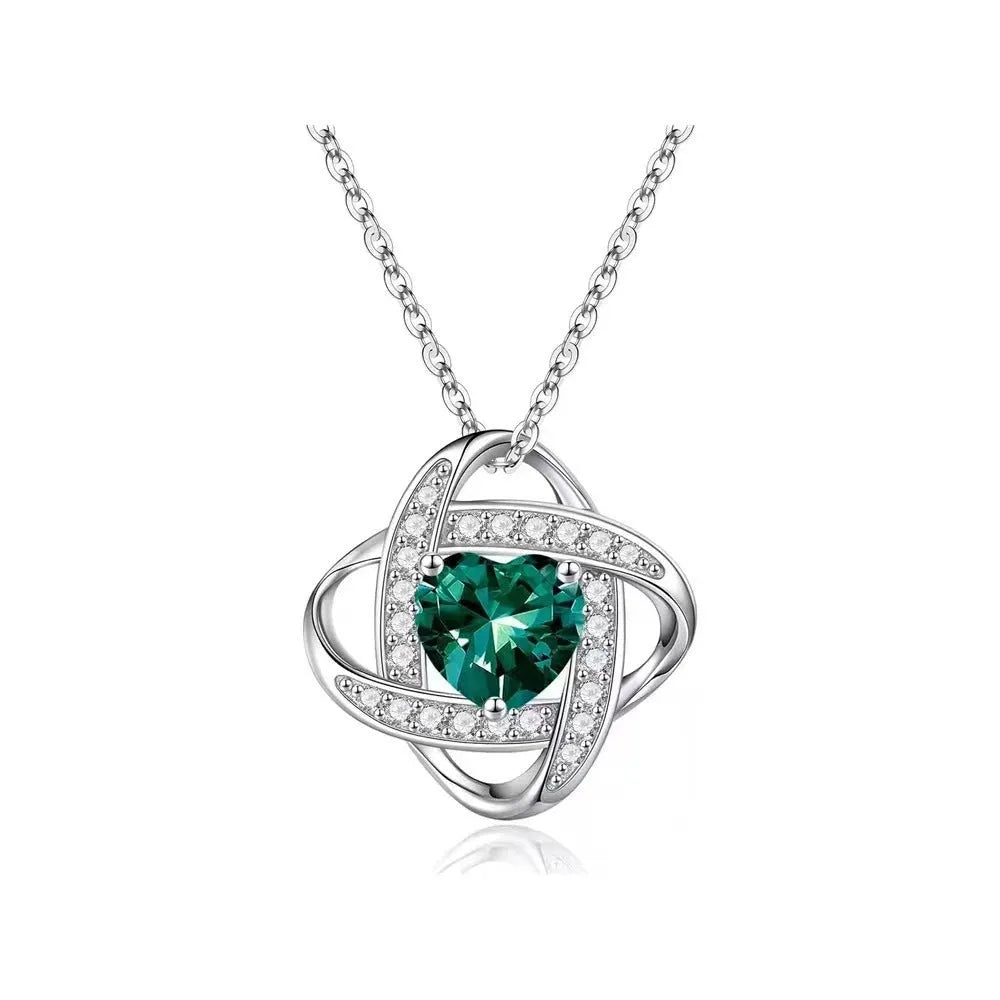 Close-up of a heart-shaped ladies necklace in electroplated copper, showing one of the platinum-toned colour options.