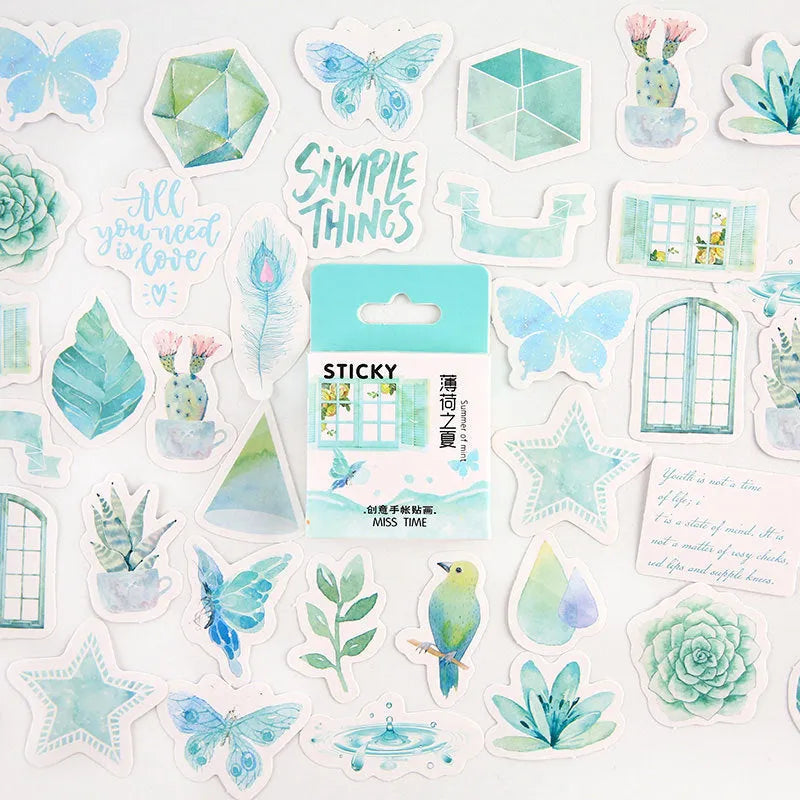 Box of 46 small colourful cartoon stickers for journal decoration and children's crafts.