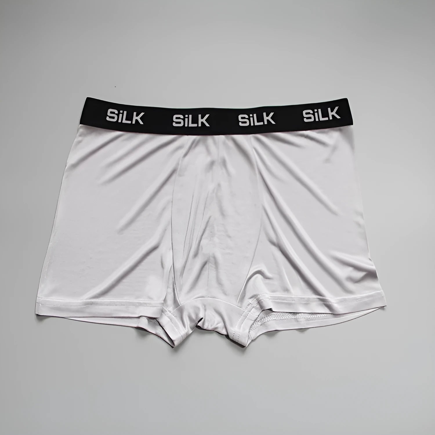 Men's silk shorts in loose fit with mid waist, available in navy blue, silver grey or skin colour