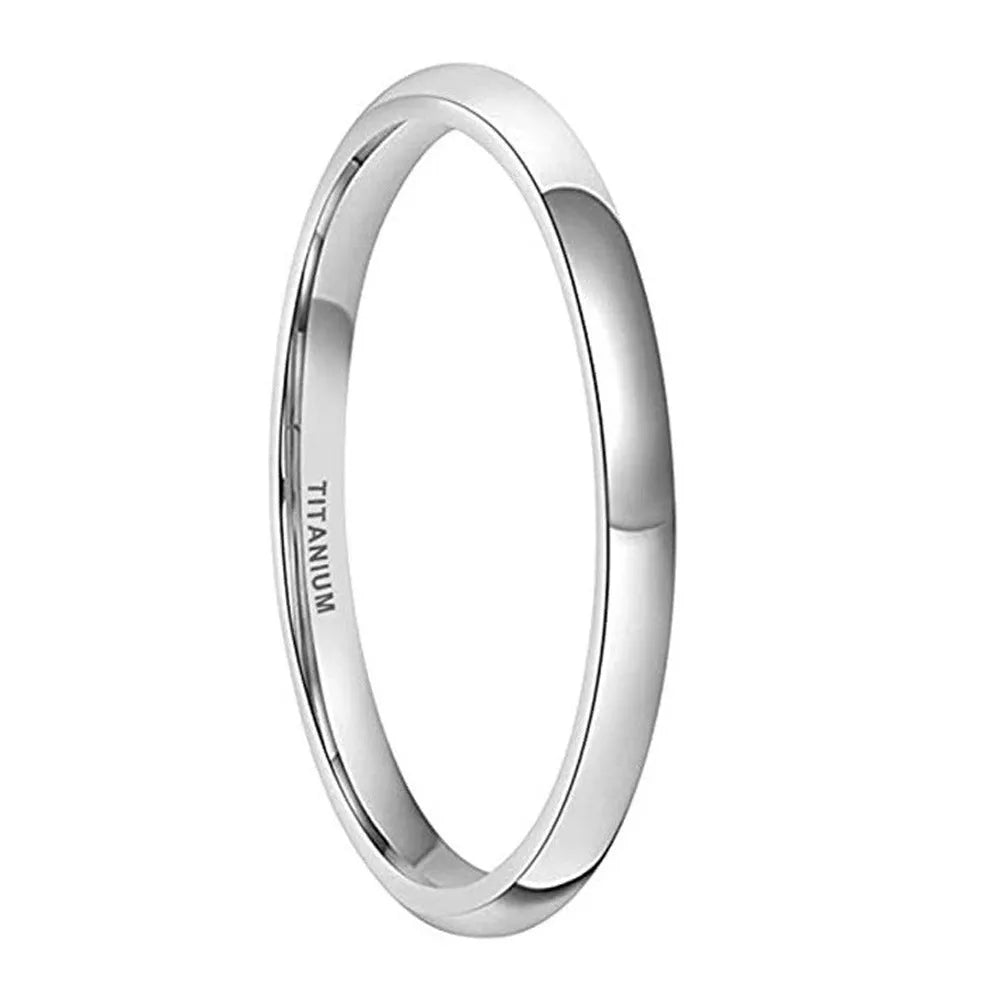 Polished silver titanium steel ring on a finger, showing a minimalist band design.