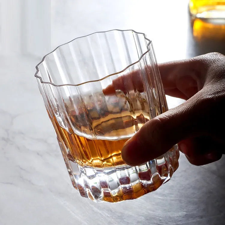 Light luxury crystal glass thick bottom lace whiskey glass with clear transparency, single tumbler style.