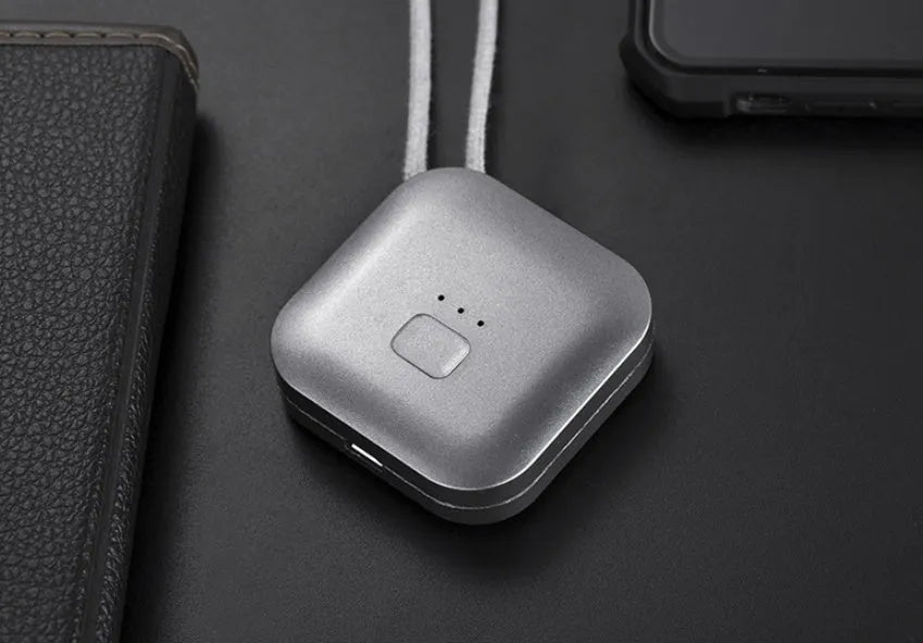 Mini USB air purifier necklace in pink showing compact wearable design with one-button control