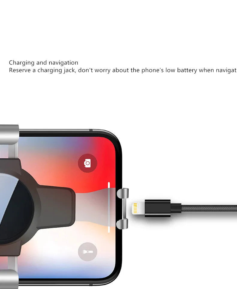 Black S4 gravity mirror ABS mobile phone bracket mounted on a car air conditioning vent.