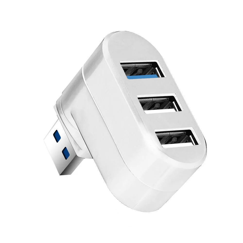 Black or white USB rotary splitter hub with four USB 3.0 ports on a desk.