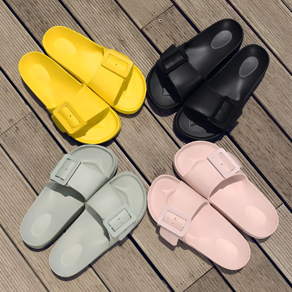 Women's grey blue flip flop slippers with a buckle strap and soft EVA sole.