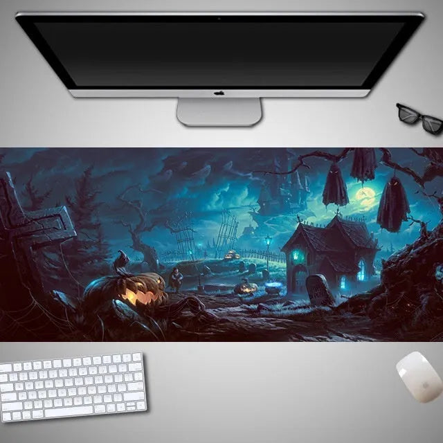 Oversized Halloween-themed computer mouse pad with non-slip rubber cloth base on a desk