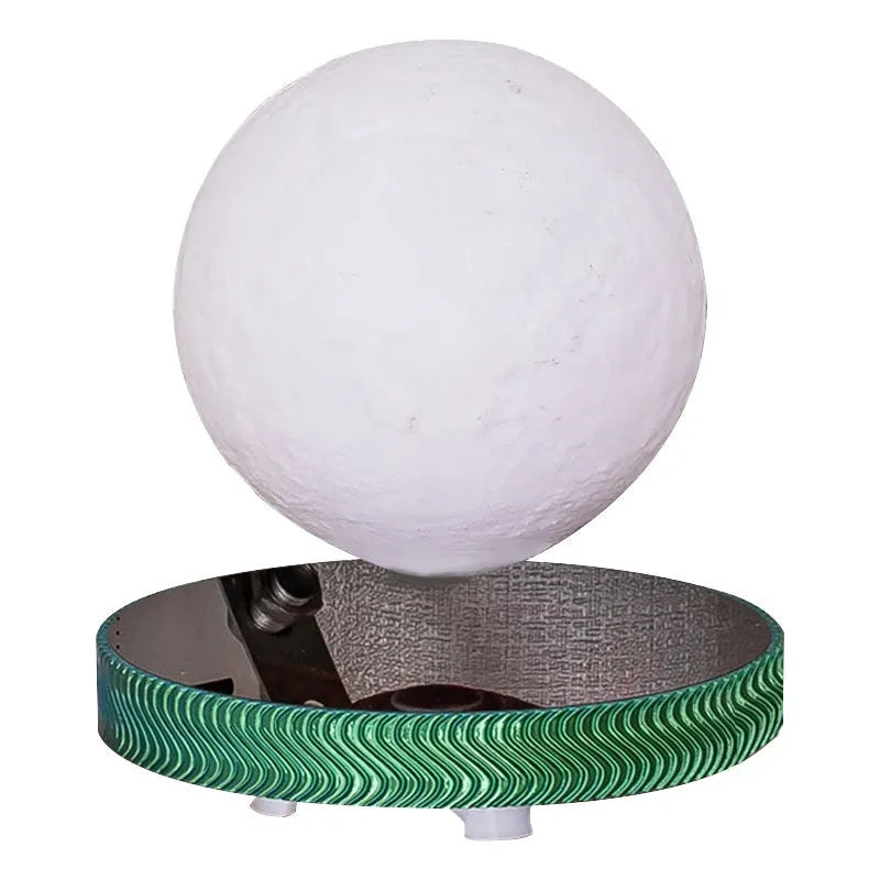 Small magnetic suspension night lamp with a levitating Moon ornament in modern 3D printed design.